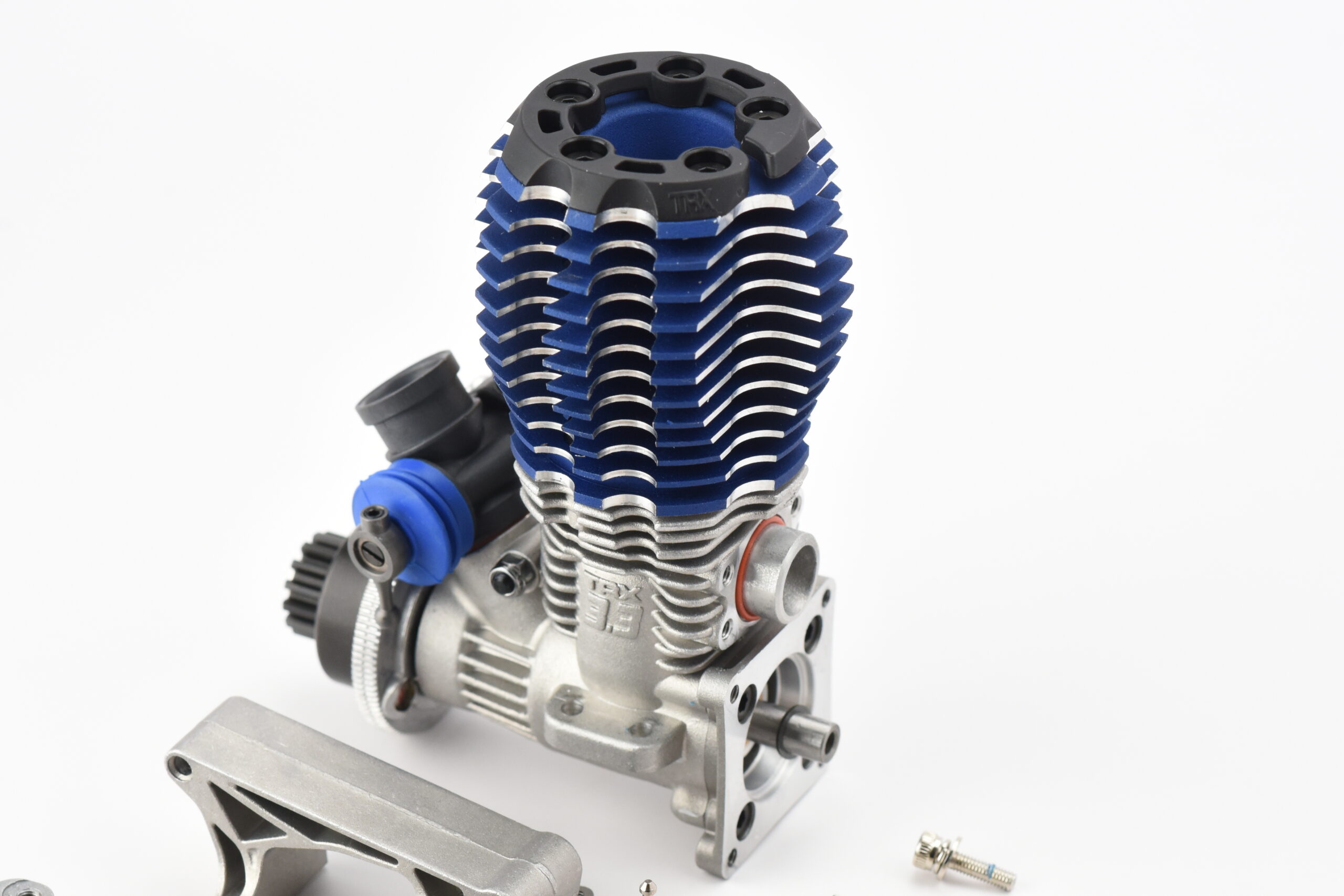 Traxxas Nitro Revo 3.3 Engine (4) Traxxas Nitro Revo 3.3 ENGINE Include Carb glow plug gear, Engine Mounts, Screws